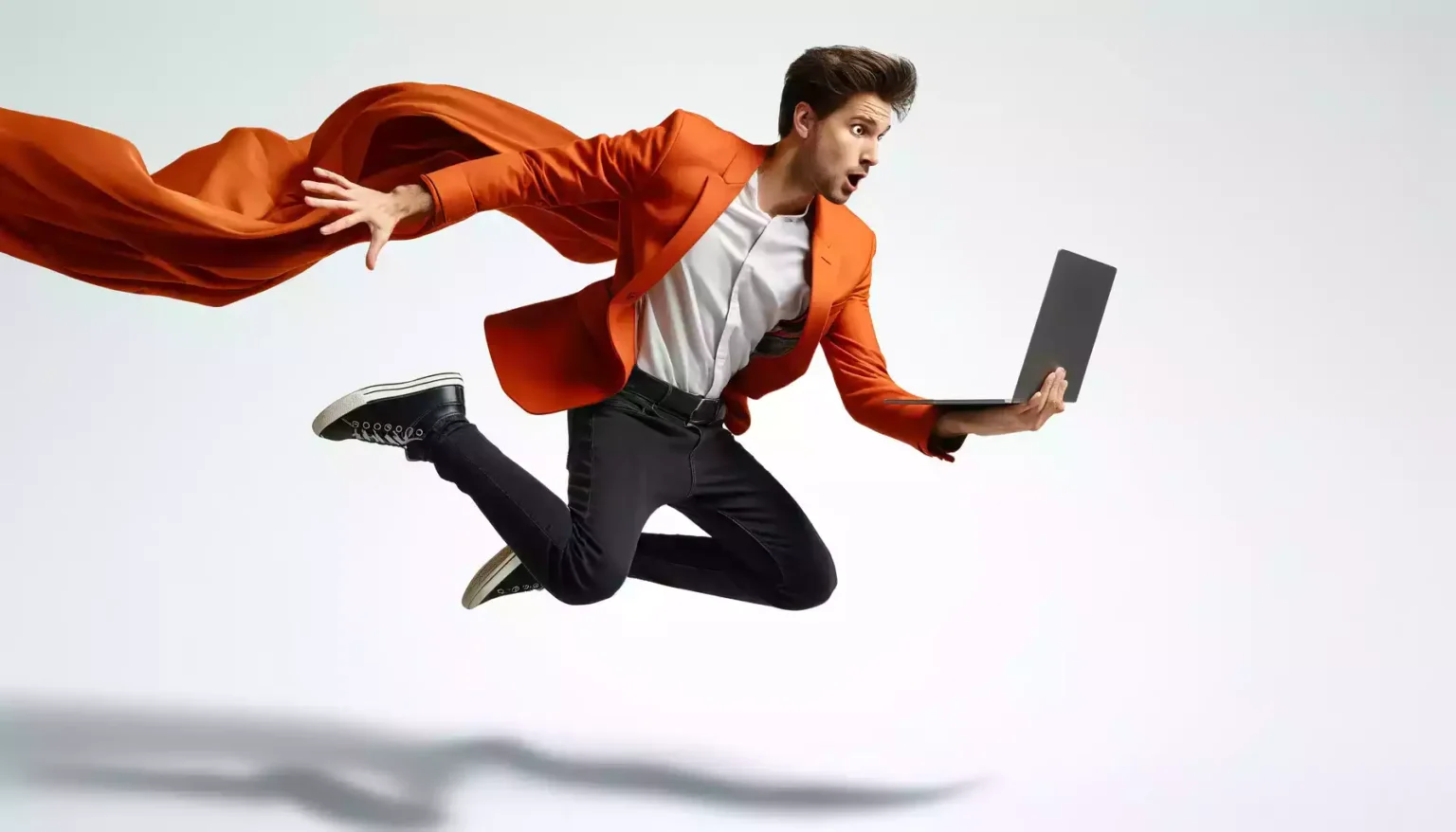 Man leaping in orange jacket, showcasing essential skills