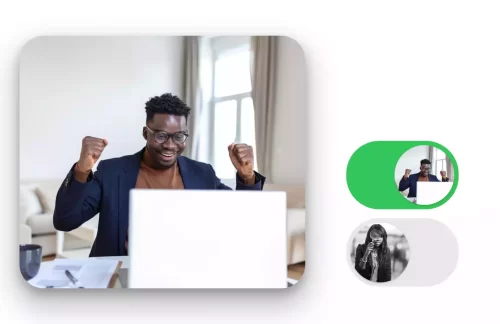 A jubilant black man viewing a laptop